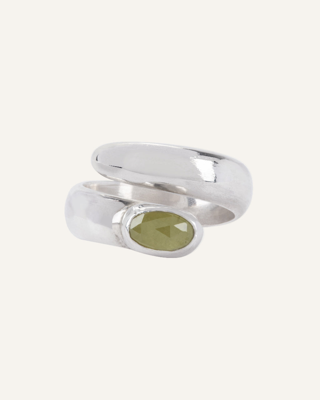 Silver ring with a yellow sapphie gemstone on a white background